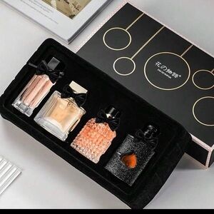 Elegant Perfume Gift Set with Black and Gold Accents